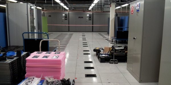 Phase 1 (2012) Machine room floor before installation. Compute servers and block storage arrays.
